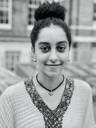 Black and white photograph of head and shoulders of a woman